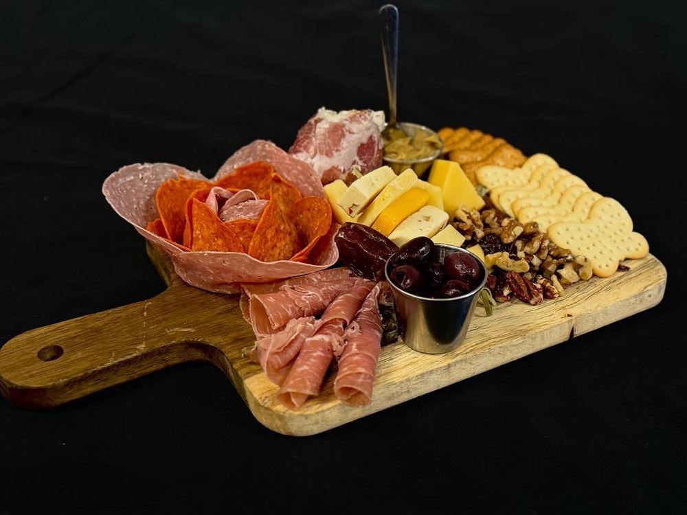 Chef's charcuterie board with artisanal cheeses and cured meats